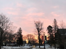 A view of Grinnell during a winter sunset from the edge of the Grinnell College campus