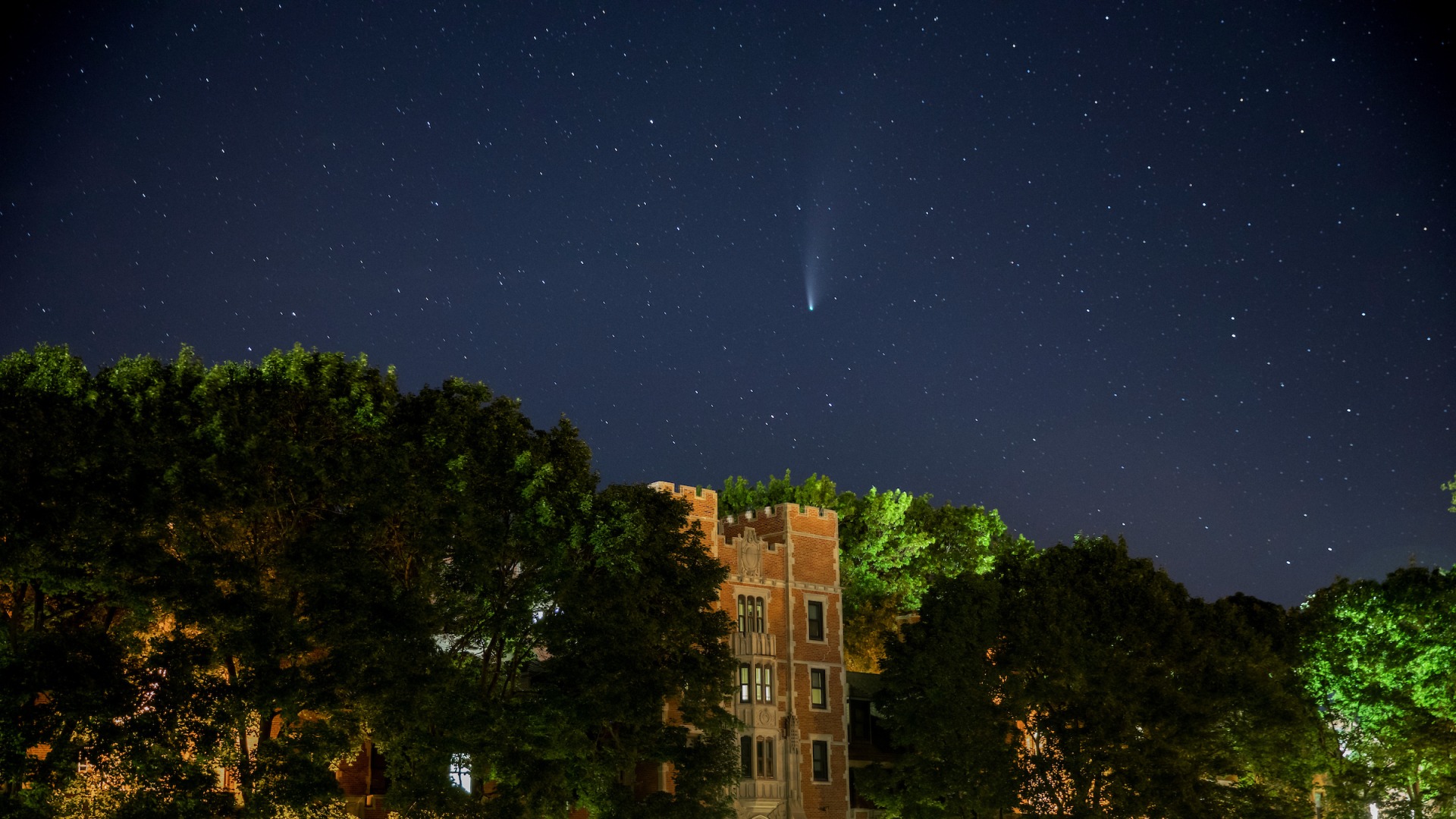 North campus with comet descending in the night sky