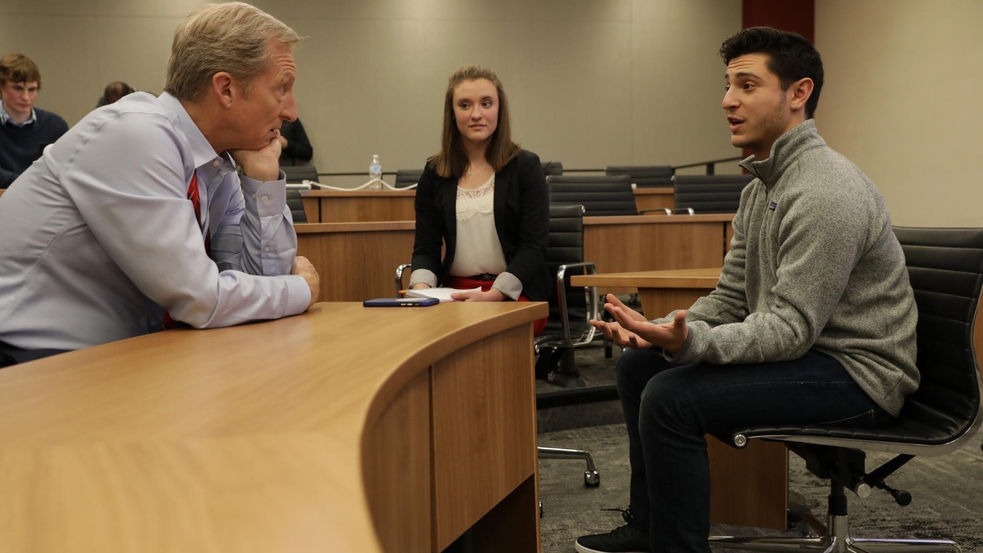 Student talking with tom steyer