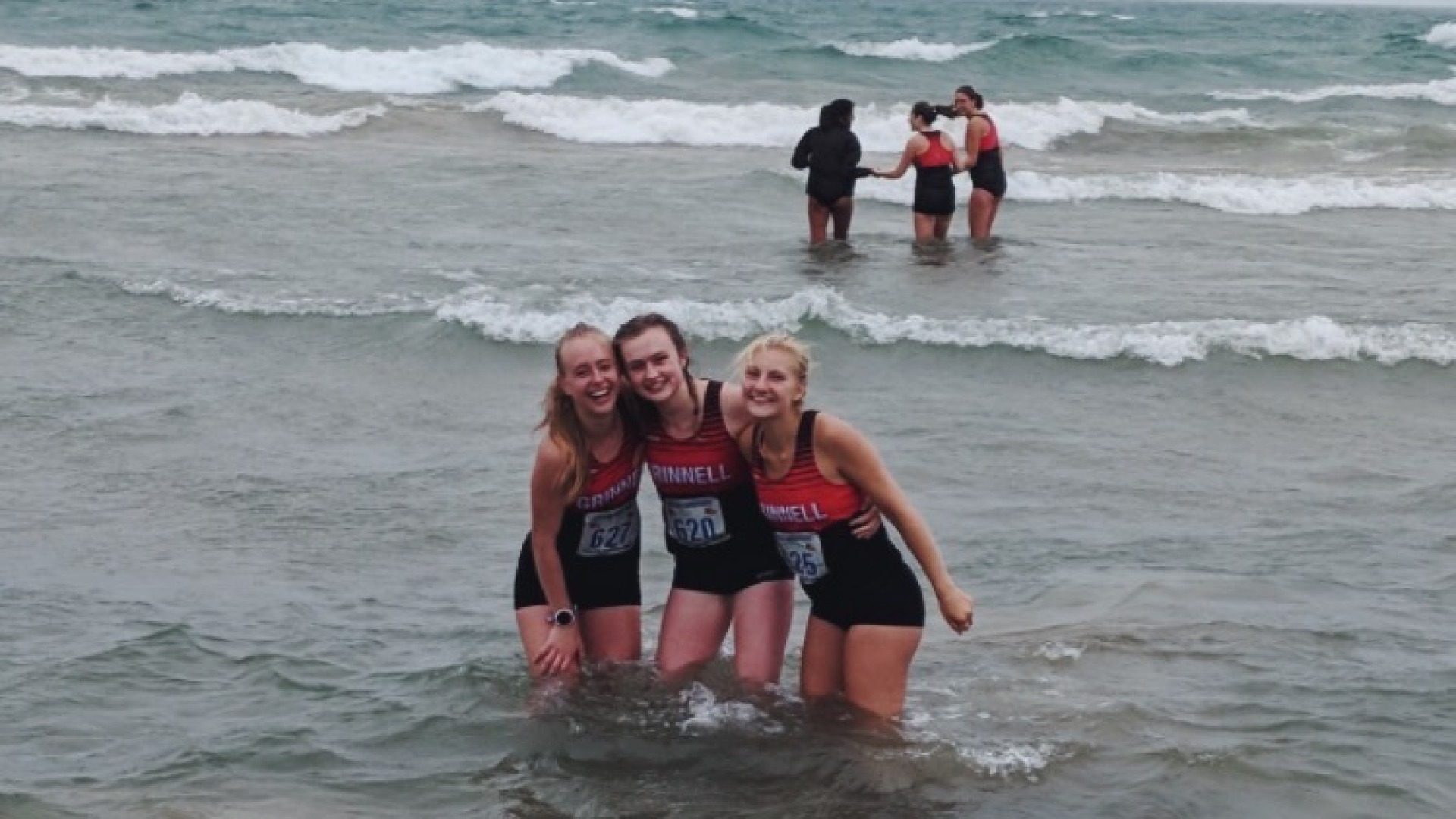 My teammates and I put our arms around each other in the freezing cold Lake Michigan after a XC meet