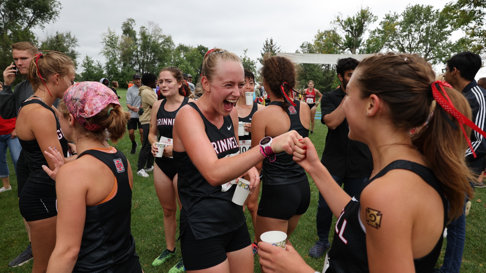 I fist bump my teammate affectionately after Les Duke home XC meet