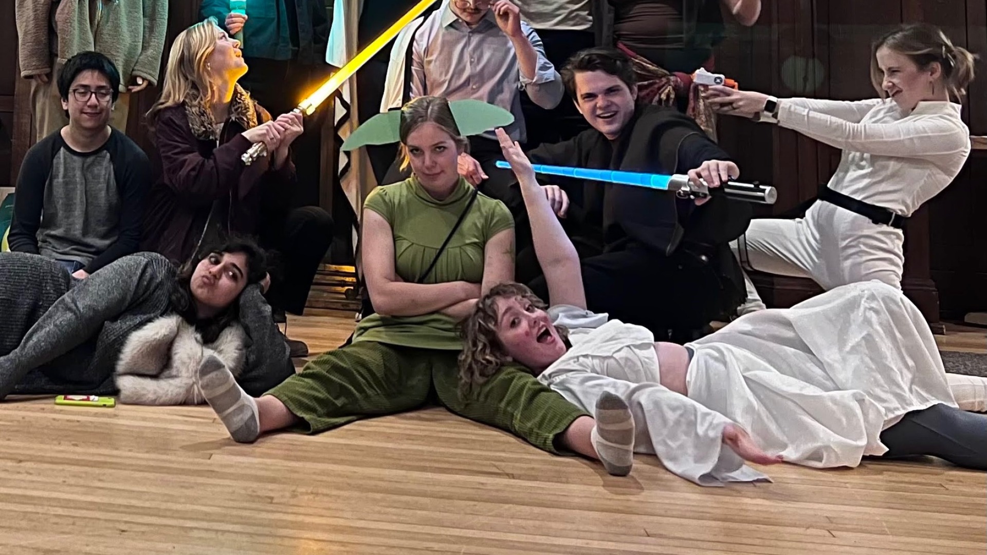 My friends and I, goofing around with light sabers in a group photo