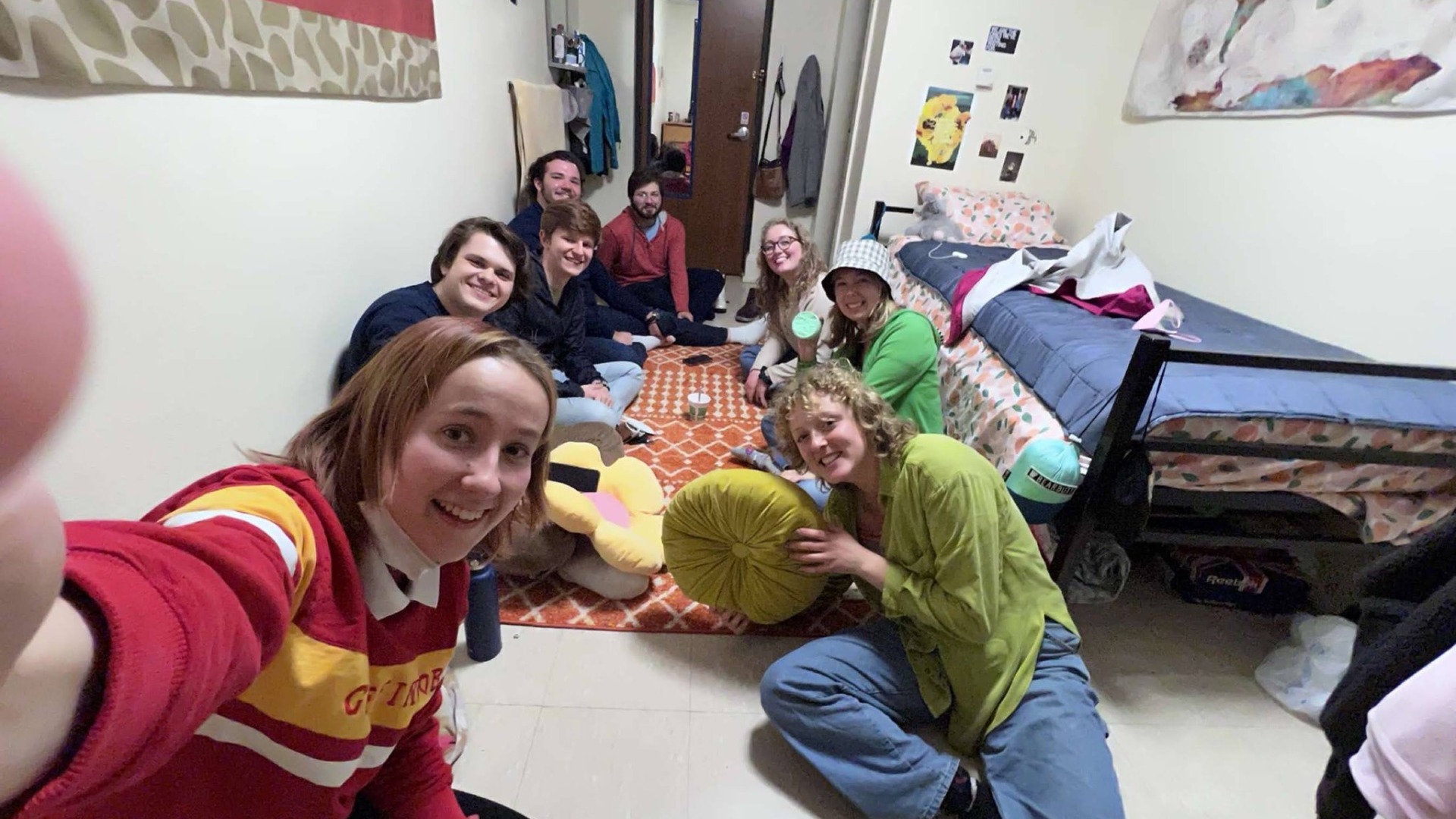 Me and my friends in a dorm room, huddled together in the small single together the selfie