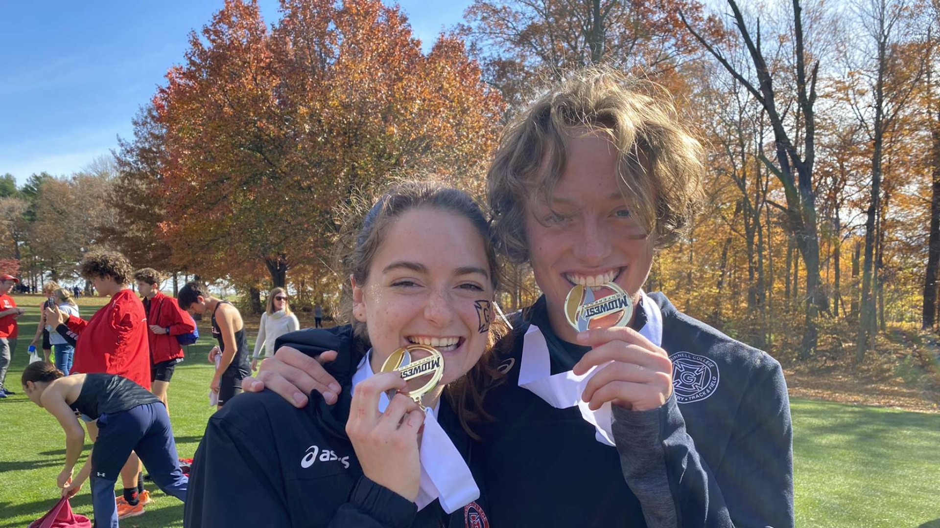 Me and Meg biting on our medals after the Invitational
