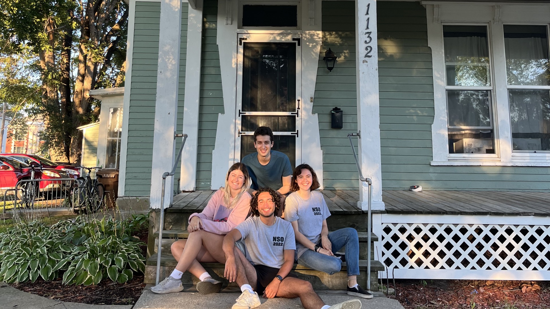 My three housemates and I sit on the front steps of our off-campus housing!