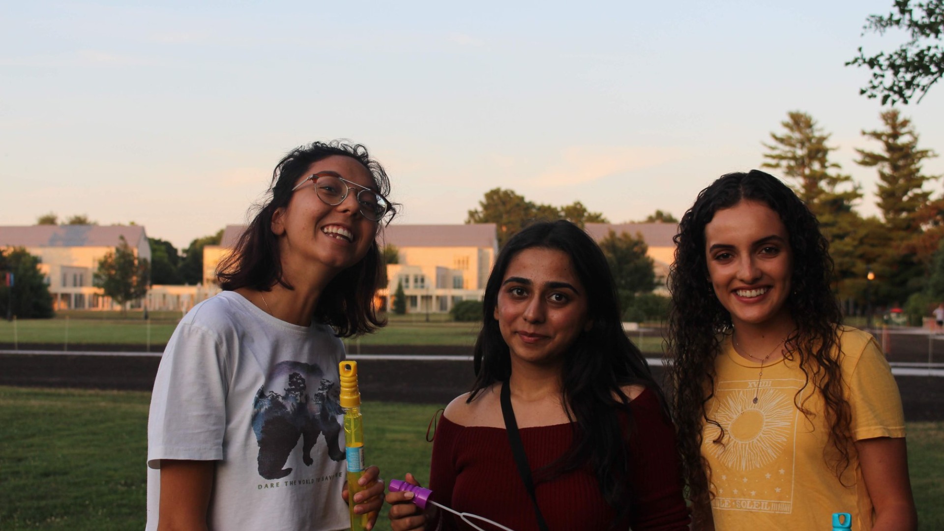 Me and my new IPOP friends smile at the camera and looking at the beautiful sunset. To our backs is East Campus.