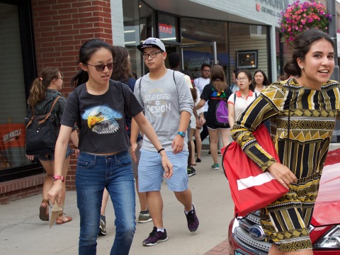 international students traveling in groups in downtown Grinnell