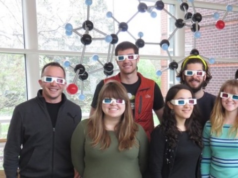 Students and their guest alum wear 3D glasses