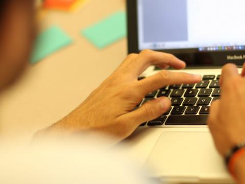 person working on a laptop computer