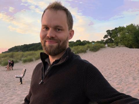 Brian Cavanagh-Strong ’09 on a beach