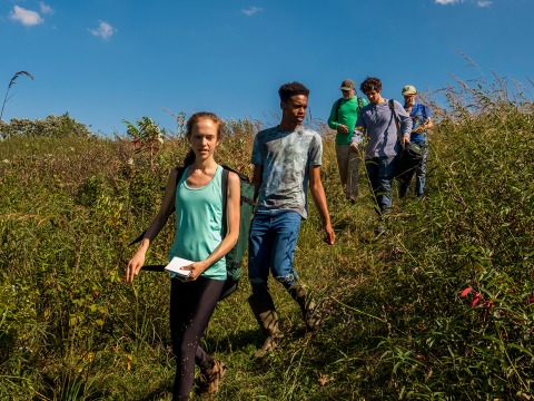 Vince Eckhart and 4 students walk through Conard Environmental Research Area