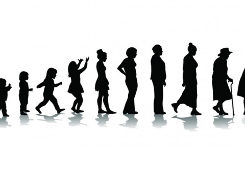 silhouette of woman at stages of life from toddler through old age 