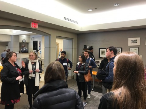 From left: Kate Rohrbuagh welcomes the group to headquarters of the Peace Corps.  