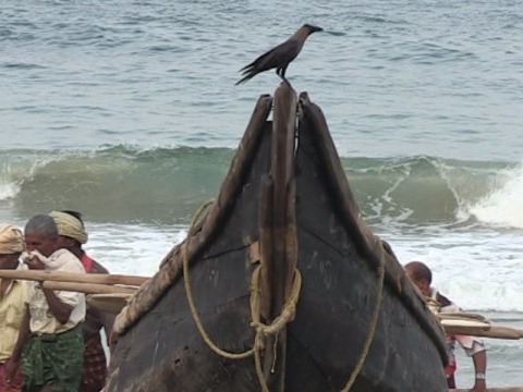 Scene from Normal is Over, men with ship on beach