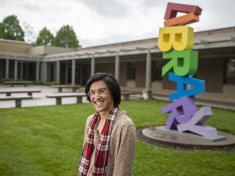 Nate Crail ’19 in front of Drake Library sculpture