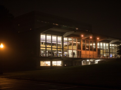 Burling Library at night, windows lit
