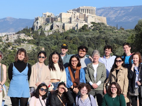 Students and Professor Monessa Cummins with the Athenian Acropolis behind them