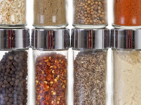 row of spices in small, clear glass jars