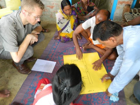 Anthony Wenndt in discussion with farmers in India