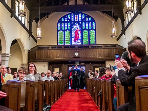 Faculty and College Leadership walk into Herrick Chapel to start the 2017 Endowed Chair Ceremony. 