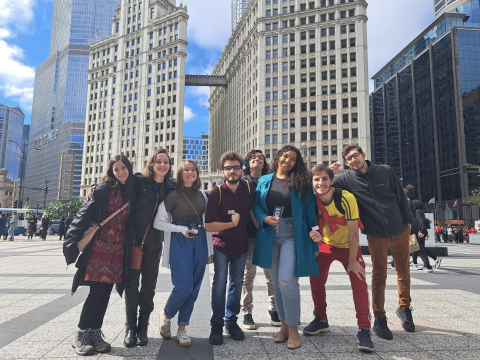 8 Brazilian students in Chicago holding their passports and cards