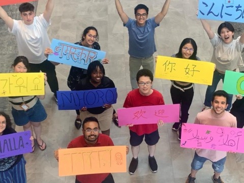 International Students at Grinnell holding signs 