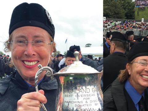Liz holding trophy in Scotland and standing with her son