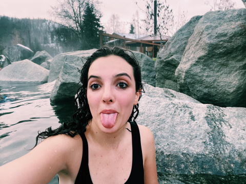 Antonella Diaz sticks her tongue out in front of the cold waters of Alaska
