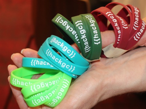 hackGC is stamped on colored silicone wristbands for team solidarity.