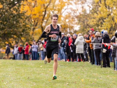 Brian looks ecstatic as he crosses the finish line in a cross country race