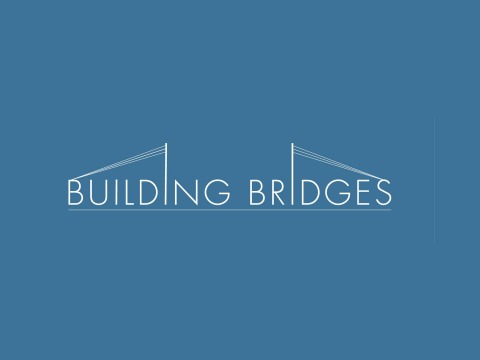 White text on blue background reads Building Bridges. The words are integrated into a stylized suspension bridge
