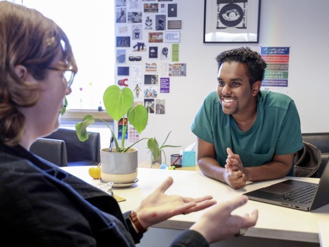 Noah Biniam converses with CLS adviser