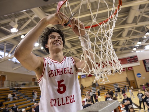basketball player cutting net