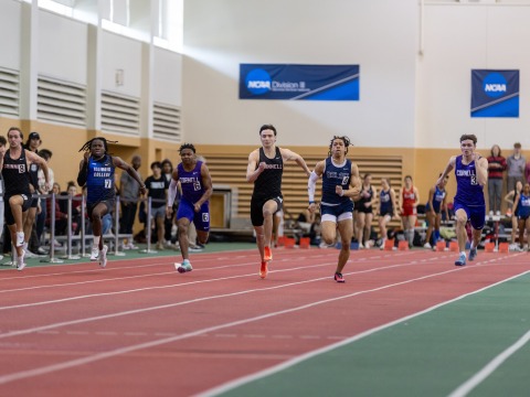 Lucas Fadden running during a meet in the Grinnell College Field House