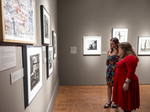 two students looking at art 