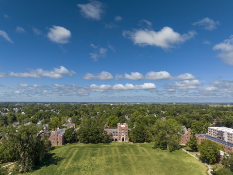 Bird's eye view of Mac Field, Gates Tower, and the city of Grinnell.