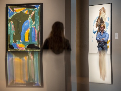 two people looking at art