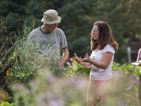 Professor Jon Andelson chats in the College Garden