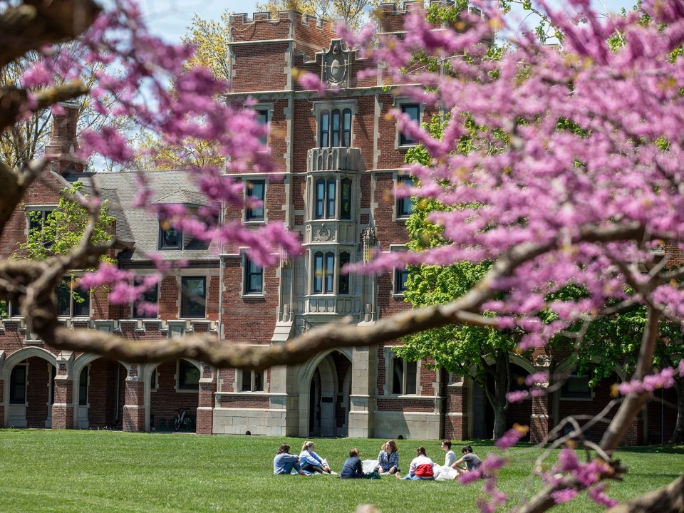 Grinnell's Gates Rawson Tower with pink spring blooms