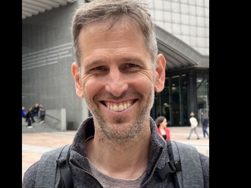 Jonathan Larson, a white man with short graying hair