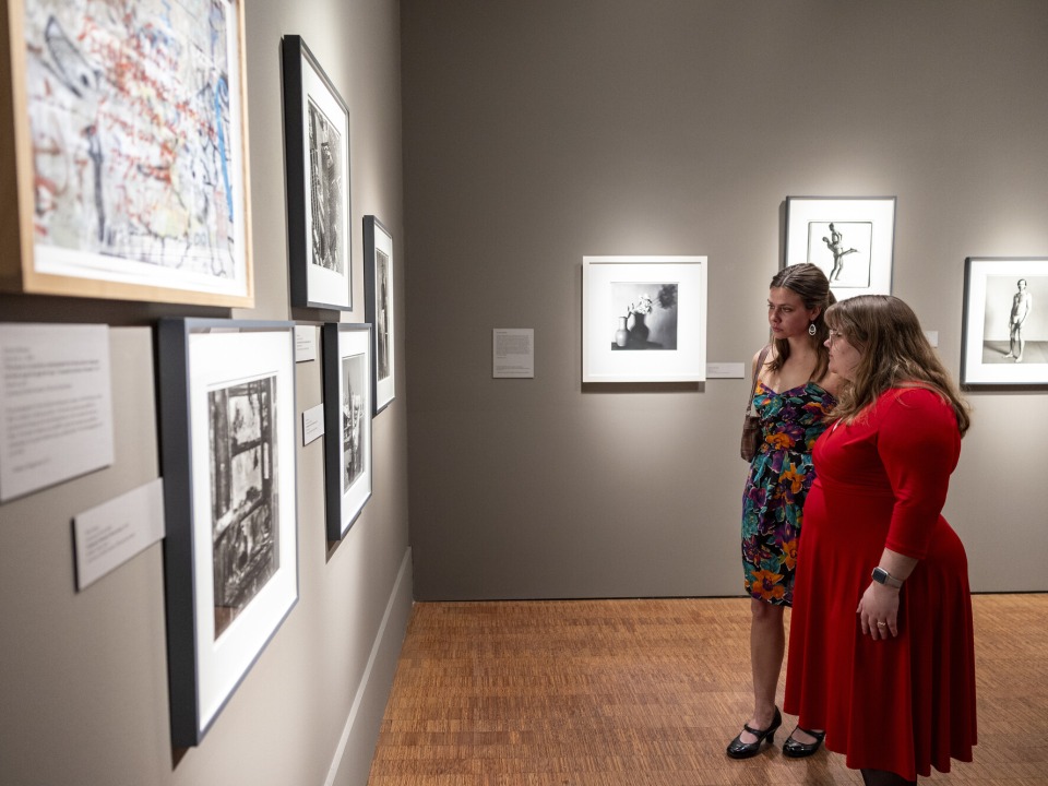 two students looking at art 