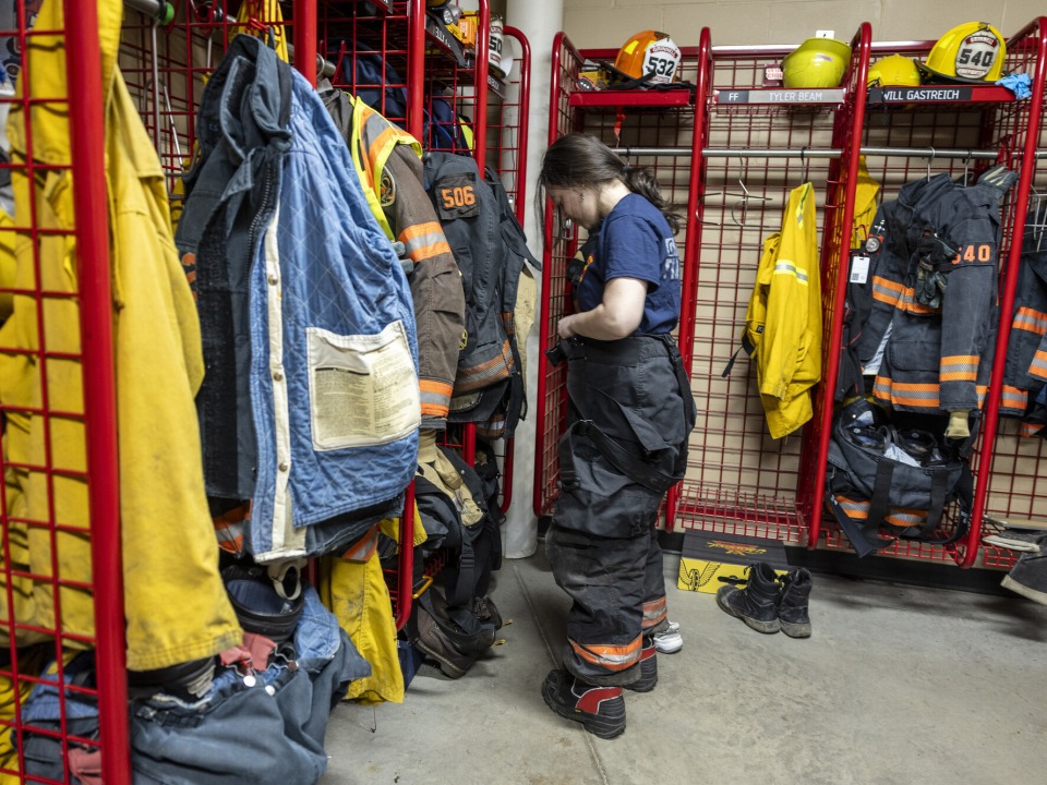 girl putting on fire suit