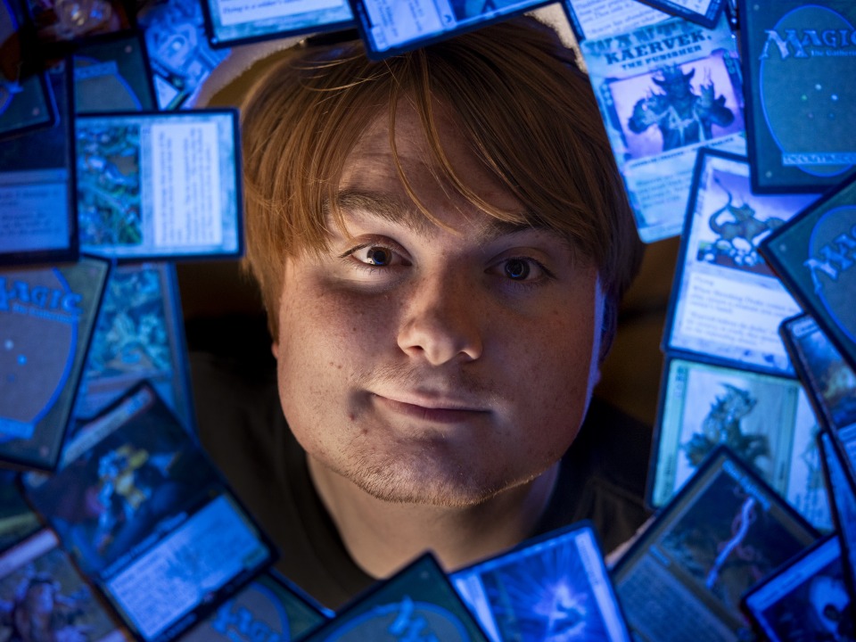 student with cards around and blue background