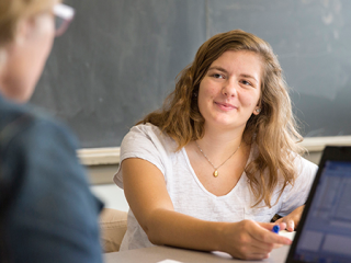 student smiling at professor