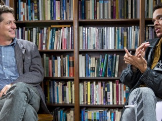 Professor Tyler Roberts and student Jermaine Stewart-Webb discussing tutorials