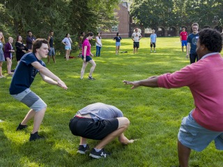 Students outside playing a lawn game during PCPOP