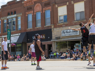 people playing basketball on the street in downtown Grinnell