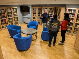 Students and Rabbi in textbook lending library