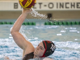 Grinnell water polo player with ball