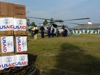 helicopter and boxes with USAID stickers